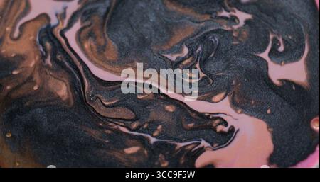 Farbmischung. Tintenhintergrund. Unschärfe Rosa schwarze Bronze Pigment Acryl Nassemulsion Tropfen kreist auf kreativer Kunst Abstraktion. Stockfoto