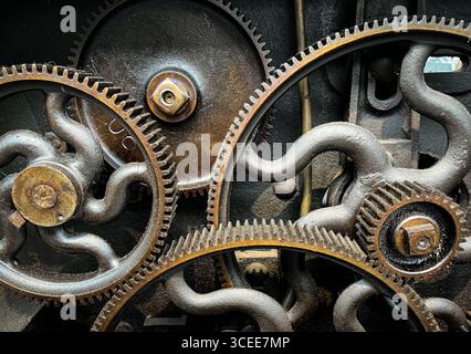 Alte Zahnräder in Vintage-Maschinen - industrielle Nahaufnahme, abstrakter Industriehintergrund Stockfoto