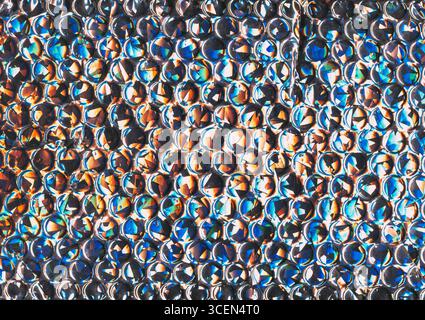 Facettierte Textur. Farbenfroher Hintergrund. Luftpolsterfolie Art Flare Runde Punkt Fantasy Licht Leck. Futuristisches abstraktes Kreismuster. Stockfoto