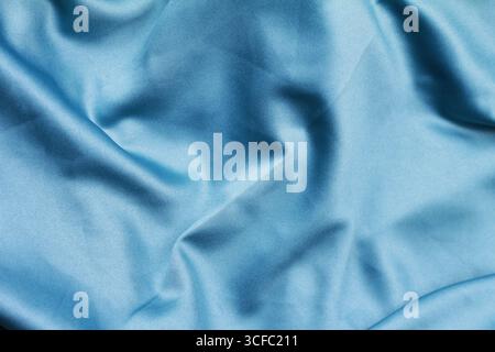 Nahaufnahme eines Stoffhintergrunds mit gewelltem Muster. Stockfoto