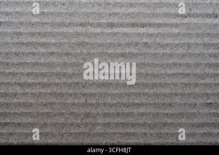 Textur aus Pappe, Detail des Musters aus braunem Papier, Nahaufnahme, Draufsicht Stockfoto