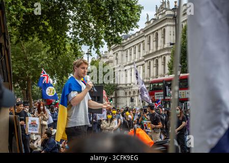 Hong Kongers und Mitglieder der chinesischen Diaspora versammelten sich in Zentral-London, um gegen den geplanten Bau einer chinesischen Mega-Botschaft zu protestieren. Demonstranten äußerten Bedenken über Pekings Einfluss und sprachen Menschenrechtsfragen an und forderten die britische Regierung auf, das Projekt einzustellen. Stockfoto