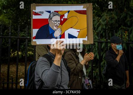 Hong Kongers und Mitglieder der chinesischen Diaspora versammelten sich in Zentral-London, um gegen den geplanten Bau einer chinesischen Mega-Botschaft zu protestieren. Demonstranten äußerten Bedenken über Pekings Einfluss und sprachen Menschenrechtsfragen an und forderten die britische Regierung auf, das Projekt einzustellen. Stockfoto