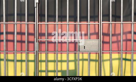 Gefängnisstangen mit deutscher Flagge im Hintergrund Stockfoto