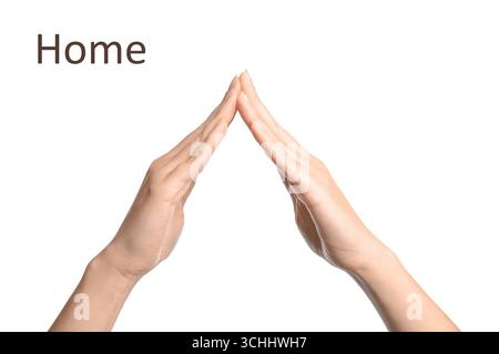 Frau zeigt Wort Haus auf weißem Hintergrund, Nahaufnahme. Gebärdensprache Stockfoto