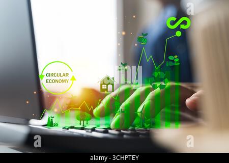 Umweltfreundliche Technologie und Kreislaufwirtschaft, die nachhaltiges Wachstum, erneuerbare Energien, umweltfreundliche Geschäftssymbole über der Laptop-Tastatur, Represen zeigen Stockfoto