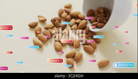 Zeigt rohe Mandeln, die aus weißem Keramikbecher auf heller Oberfläche verschüttet werden, mit digitalen metrischen Überlagerungen. Minimalistisch, Ernährung, Gesundheit, Technologie, Daten VI Stockfoto