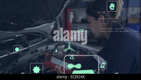 Mechanisch bedienbarer Scanner unter der Autohaube in Overalls in der Werkstatt, Anzeige von Overlays, Kopierraum Stockfoto