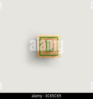 Ein Holzblock mit dem Buchstaben „L“ in Grün auf hellem Hintergrund. Stockfoto