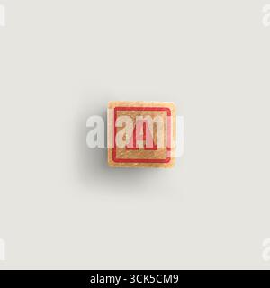 Ein Holzblock mit dem Buchstaben „A“ in Rot, der in der Regel für Bildungszwecke oder als Spielzeug für Kinder verwendet wird. Stockfoto