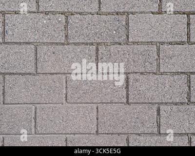 Graue Steinpflasterhintergrundstruktur Stockfoto