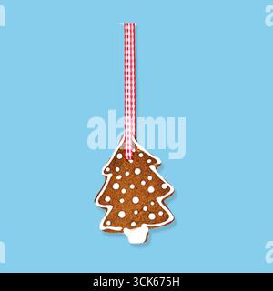 Ein dekorativer Lebkuchenkeks in Form eines Weihnachtsbaums, mit weißen Glaspunkten verziert und an einem roten Band gehängt. Stockfoto