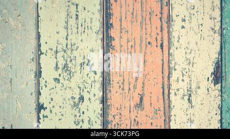 Eine Nahaufnahme verwitterter Holzdielen in verschiedenen Pastellfarben, die Textur und Vintage-Charme zeigen. Stockfoto
