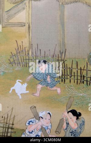 Detail aus Szenen in und um Kyoto von Sumiyoshi Gukei, Edo-Zeit, 17. Jahrhundert; Tokyo National Museum, Japan; Junge spielt mit Hund, Kind. Stockfoto