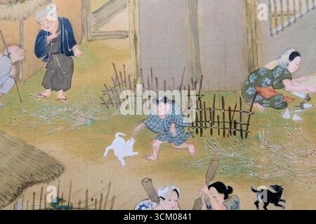 Details aus Szenen in und um Kyoto von Sumiyoshi Gukei, Edo-Zeit, 17. Jahrhundert; Tokio Nationalmuseum, Japan. Junge spielt mit Hund, Kind. Stockfoto