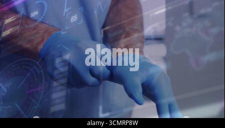 Doktor trägt blaue Schürze, die Handschuhe im Krankenhauszimmer an die Hand ziehen, mit Überlagerung der medizinischen Daten Stockfoto