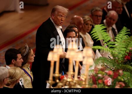 US-Präsident Donald Trump hält seine Rede als Prinzessin von Wales und Gäste hören während des Staatsbanketts für den US-Präsidenten und First Lady Melania Trump in Windsor Castle, Berkshire, am ersten Tag ihres zweiten Staatsbesuchs in Großbritannien zu. Bilddatum: Mittwoch, 17. September 2025. Stockfoto