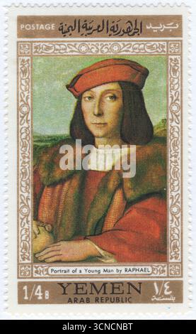 JEMEN ARABISCHE REPUBLIK – 17. November 1967: ¼ buqsha mehrfarbige Briefmarke mit dem Porträt eines jungen Mannes mit einem Apfel, von florentiner Meister Raphael. Es handelt sich um ein Pappelöl-Gemälde des italienischen Hochrenaissance-Malers Raphael, das um 1505 ausgeführt wurde. Sie befindet sich in den Uffizien in Florenz. Wahrscheinlich für die Familie della Rovere/Montefeltro in Urbino gemacht, wird es oft als Porträt von Francesco Maria I. della Rovere angesehen, Enkel von Federico da Montefeltro und zukünftiger Herzog von Urbino, der 1504 von seinem Onkel, Papst Julius II. Arrangiert wurde Stockfoto