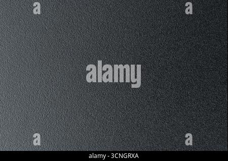 Schwarze Metallbeschichtung Oberfläche Verlaufshintergrund Nahansicht Stockfoto