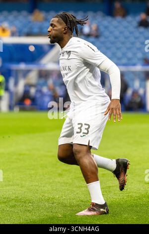 ROCKY BUSHIRI, professioneller Fußballspieler, spielt derzeit für den Hibernian FC. Bild, das während einer Aufwärmphase vor dem Spiel und einer Trainingssitzung aufgenommen wurde. Stockfoto
