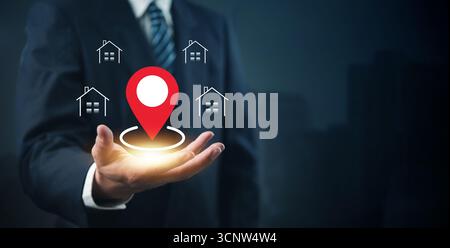 Immobilienstandortkonzept mit GPS-Pin- und Haussymbolen, die die Immobiliensuche, kartenbasierte Hausauflistungen und intelligente Wohnungsnavigation darstellen. Stockfoto