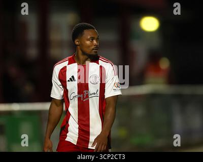BRACKLEY, ENGLAND – 23. SEPTEMBER: Justin Donawa aus Brackley Town während des Spiels der Enterprise National League zwischen Brackley Town und Truro City im St. James Park am 23. September 2025 in Brackley, Großbritannien. (Foto von Mitch Davidson/Brackley Town FC via Alamy Live News) Stockfoto
