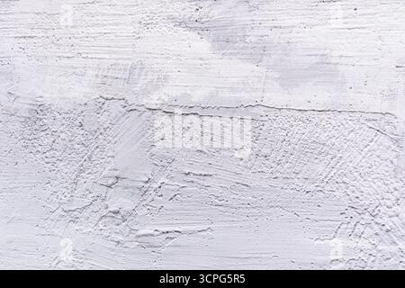 Abstrakter Hintergrund einer mit blauer Farbe gemalten Steinmauer. Wandstruktur aus Naturstein in hellen Farben. Ein Kopierbereich. Layout für Design Stockfoto