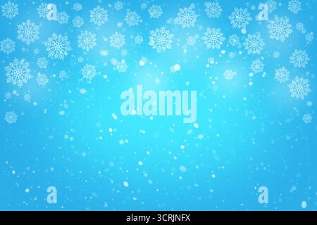 Winterblauer Hintergrund mit fallenden Schneeflocken und weichem Leuchten für festliches Weihnachtsthema Stockfoto