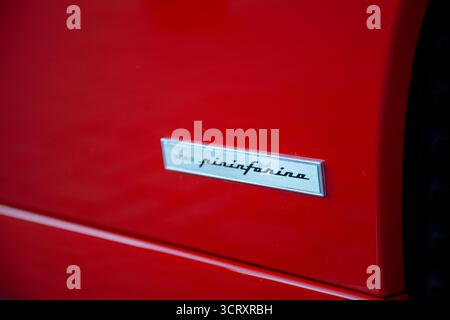 Vilnius, Lithuania - 2025-09-20 - Pininfarina logo on classic red Ferrari sports car close up Stockfoto