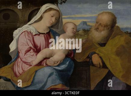 Die Heilige Familie, zwischen 1513 und 1515. Das Thema der Heiligen Konversation war in der venezianischen Kunst sehr beliebt, besonders im 16. Jahrhundert. Dieses Motiv wurde wiederholt von Palma Vecchio aufgegriffen, dessen kleine Gemälde hauptsächlich im Auftrag privater Empfänger entstanden. Sie stellten die Heilige Familie oder die Jungfrau Maria mit dem Kind dar, oft in Begleitung anderer Heiliger. Maria übergibt das Kind dem heiligen Joseph und er streckt seine Hände aus. Auf diese Weise wurde die wichtige Rolle des hl. Josef als würdiger Beschützer Mariens und Jesu hervorgehoben, die mit dem wachsenden Kult des Heiligen in t verbunden war Stockfoto