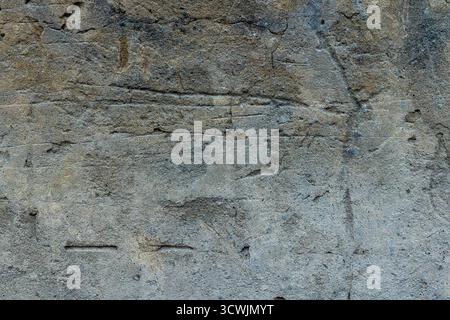 Alte raue Gipsstruktur mit Kratzern und Rissen Stockfoto