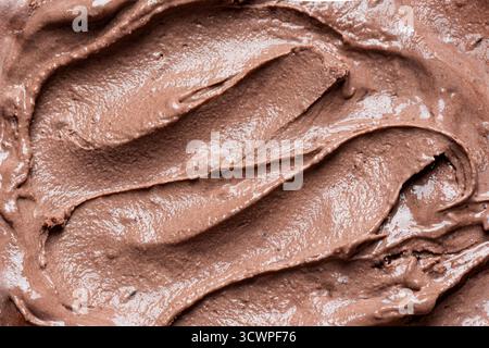 Schokoladeneis als Hintergrund Nahaufnahme. Schokoladenbraunes Eis. Stockfoto