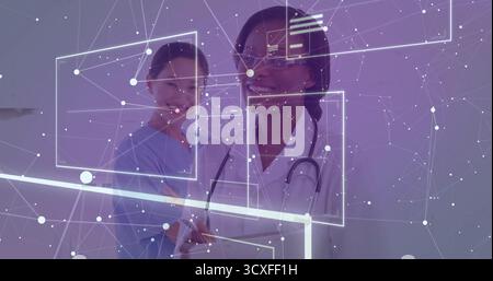 Untersuchungsschnittstelle, zwei Ärzte tragen Peelings und Mantel mit Tablette und Stethoskop im Untersuchungsraum Stockfoto