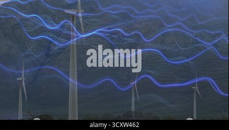 Anzeige des zentralen Turms der Windkraftanlage auf grünem Fuß, mit welligen blauen Datenwellenformen Stockfoto