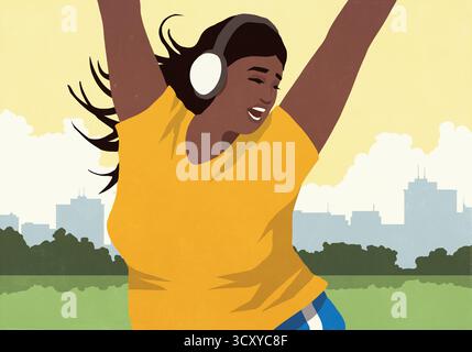 Fröhliche, energiegeladene junge Frau mit Kopfhörern, die Musik hören und im sonnigen Stadtpark tanzen Stockfoto