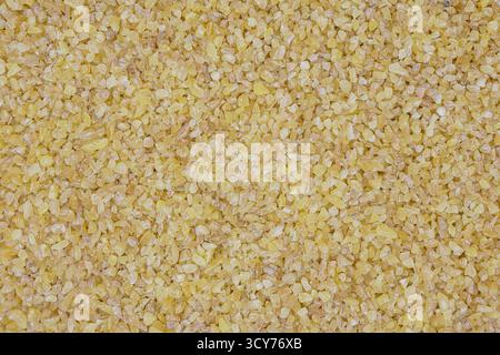 Ein Nahaufnahme-Bulgur. Der strukturierte abstrakte Hintergrund. Stockfoto