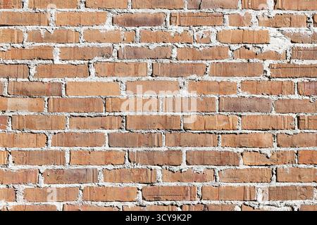 Nahaufnahme der alten Ziegelmauerstruktur. Rustikaler roter Backsteinhintergrund mit natürlichem Muster und rauer Struktur. Stockfoto