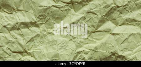 Zerknittertes grünes Papier mit Nahaufnahme zerknitterter Oberfläche Stockfoto
