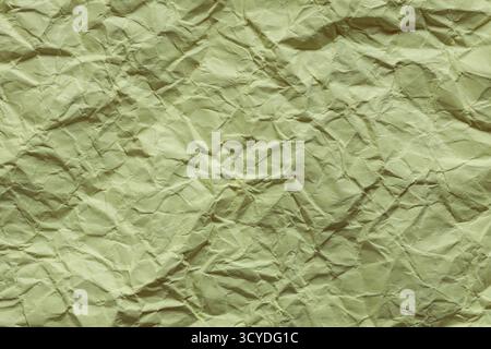 Zerknittertes grünes Papier mit Nahaufnahme zerknitterter Oberfläche Stockfoto