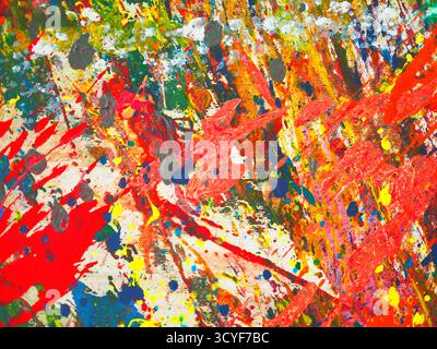 Abstrakt lebendiger Farben, die über die Leinwand gespritzt werden Stockfoto
