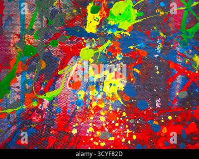 Abstrakt lebendiger Farben, die über die Leinwand gespritzt werden Stockfoto