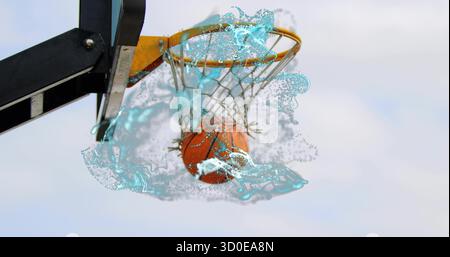 Orangener Basketball, der durch das Netz am Outdoor-Basketball geht, wirbelnder, wasserähnlicher Splash-Effekt Stockfoto