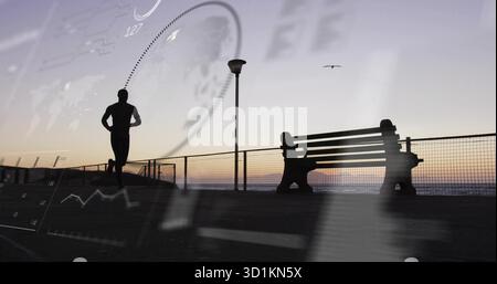 Jogging-afroamerikanischer Mann mit Jacke und Leggings entlang der Strandpromenade, mit Datenüberlagerungen Stockfoto