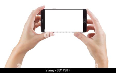 Weibliche Hände, die ein Smartphone halten, mit leerem Bildschirm auf weiß Stockfoto