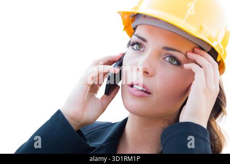 Besorgte Weibliche Unternehmerin In Hard Hat Mit Mobiltelefon Isoliert Auf Weiß Stockfoto