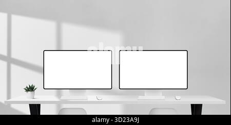 Zwei Computermonitore mit leeren Bildschirmen auf weißem Schreibtisch, Sonnenlicht und Schatten schaffen einen hellen Arbeitsbereich für Design, Teamwork oder geschäftliche Projekte Stockfoto