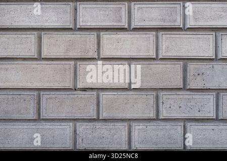 Graue Ziegelwand-Nahstruktur Stockfoto