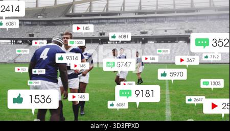 Rugbyspieler in Trikots und Shorts auf dem Stadionfeld mit schwebenden Social-Media-Ikonen Stockfoto
