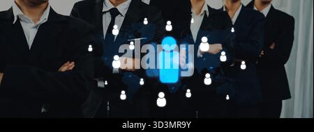 Dieses Bild zeigt die Essenz von Unternehmensnetzwerken und zeigt Profis in Anzügen mit Symbolen für digitale Verbindungen, die modern sind Stockfoto