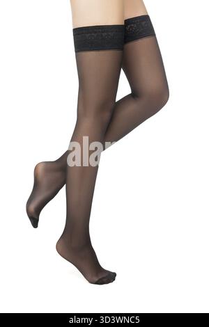 Nahaufnahme einer nicht erkennbaren stehenden Frau in schwarzen Schläuchen Stockfoto